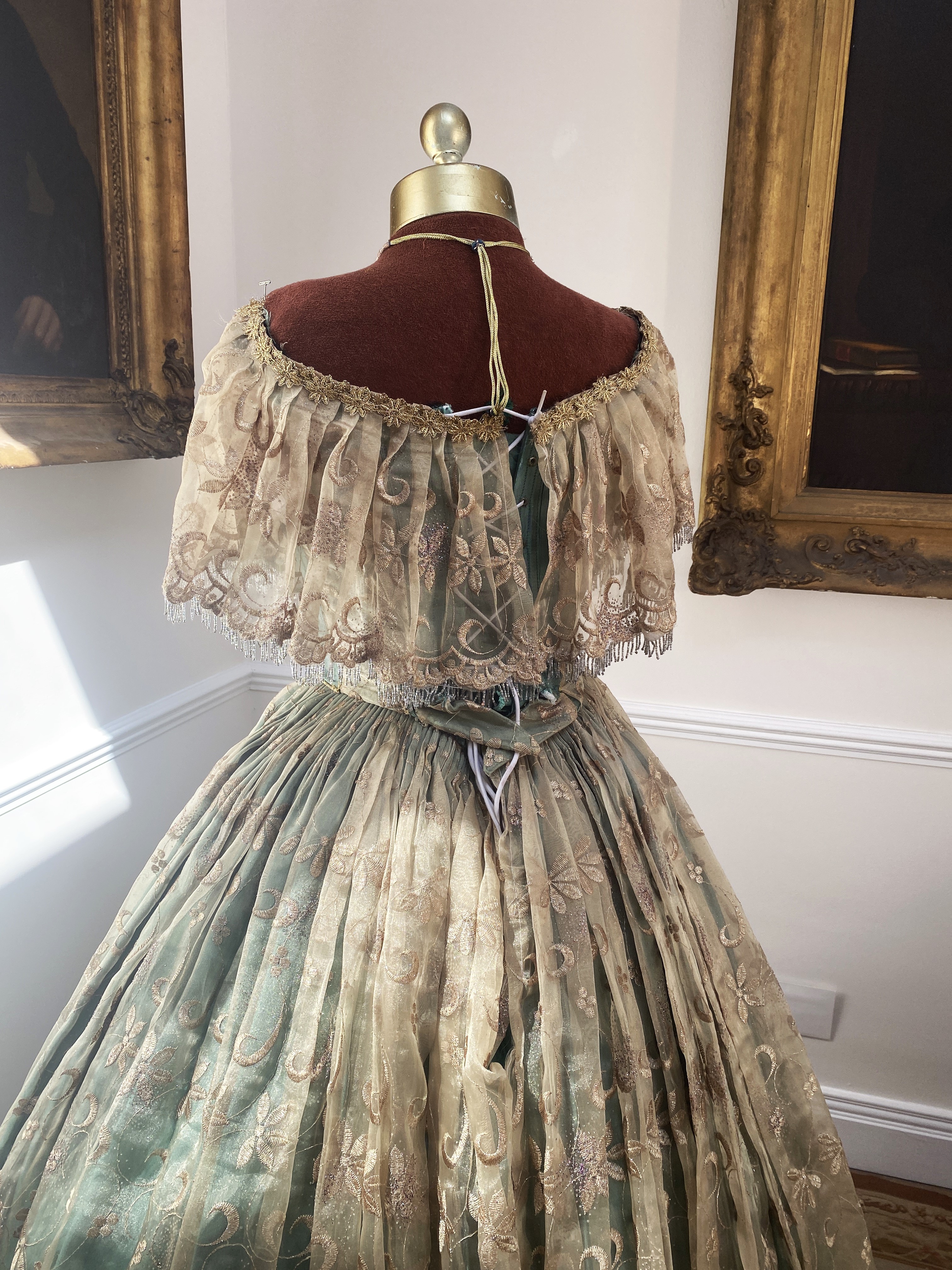 A Victorian style evening gown – green silk with gold transparent overskirt. Size adjustable 10/14